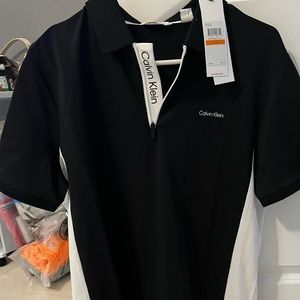 Calvin Klein black and white polo. Perfect condition brand new with tags.